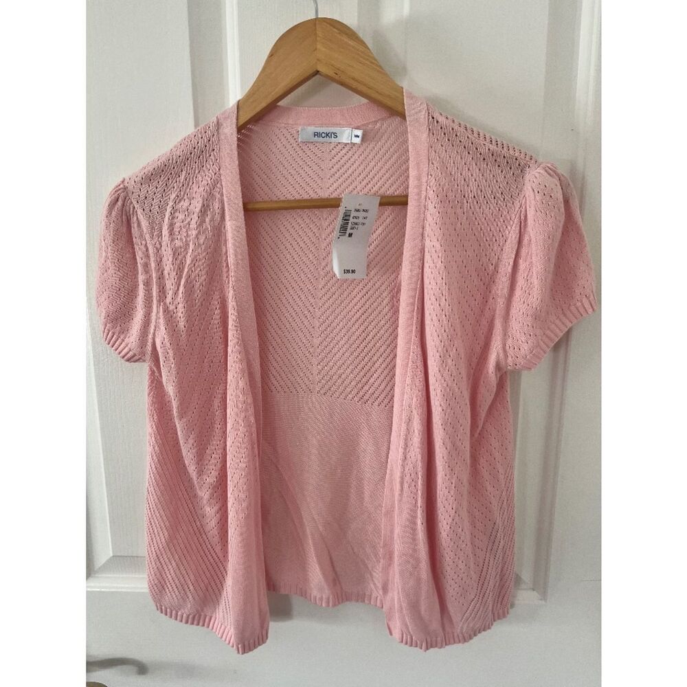 Pink short sleeved sweater.